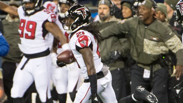 Atlanta Falcons cornerback Desmond Trufant (21) runs back an interception during the first half against the Atlanta Falcons at CenturyLink Field.